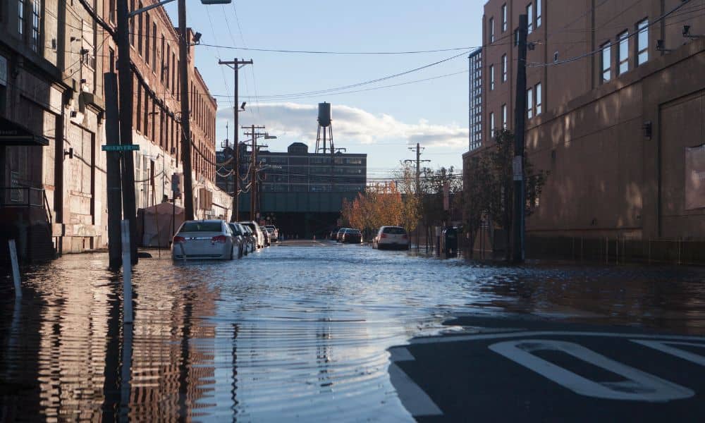 Flooded city street after heavy rain showing the impact of poor stormwater design