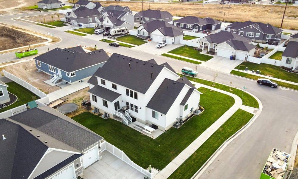 Aerial view of suburban homes during loan closing survey process