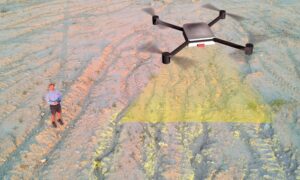 Drone land survey overlay - ALTA SURVEY Nashville Drone technician using Lidar mapping to scan ground features during a land survey