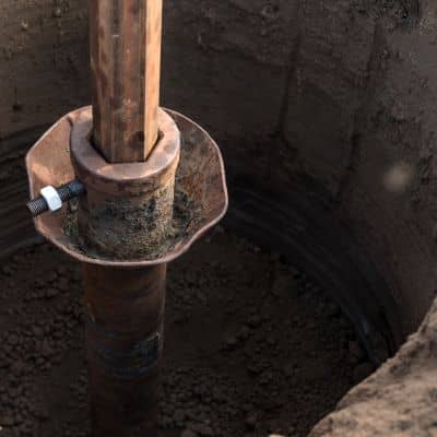 Close-up of a groundwater monitoring point installed in a borehole, a common step in geotechnical engineering for tunnel risk planning