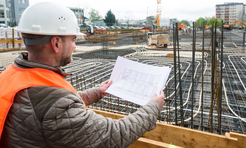 Construction management review of building plans on an active land development site
