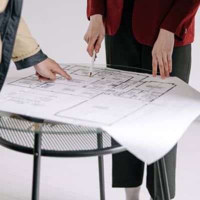 Residential property survey plat review - ALTA SURVEY Nashville Land surveyor reviewing a property survey plat and boundary measurements