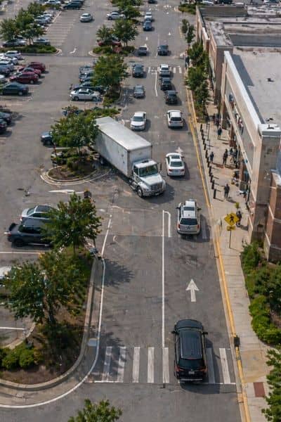 Close-up view of a parking lot showing vehicle movement, turning paths, and circulation patterns that reflect how site development decisions affect real-world traffic flow